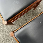 Set of 2 vintage Scandinavian chairs in wood and black faux leather.