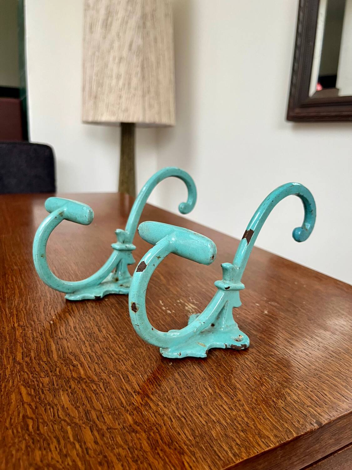 Pair of painted metal wall hooks