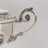 Silver sugar bowl with paw feet and ornate handles