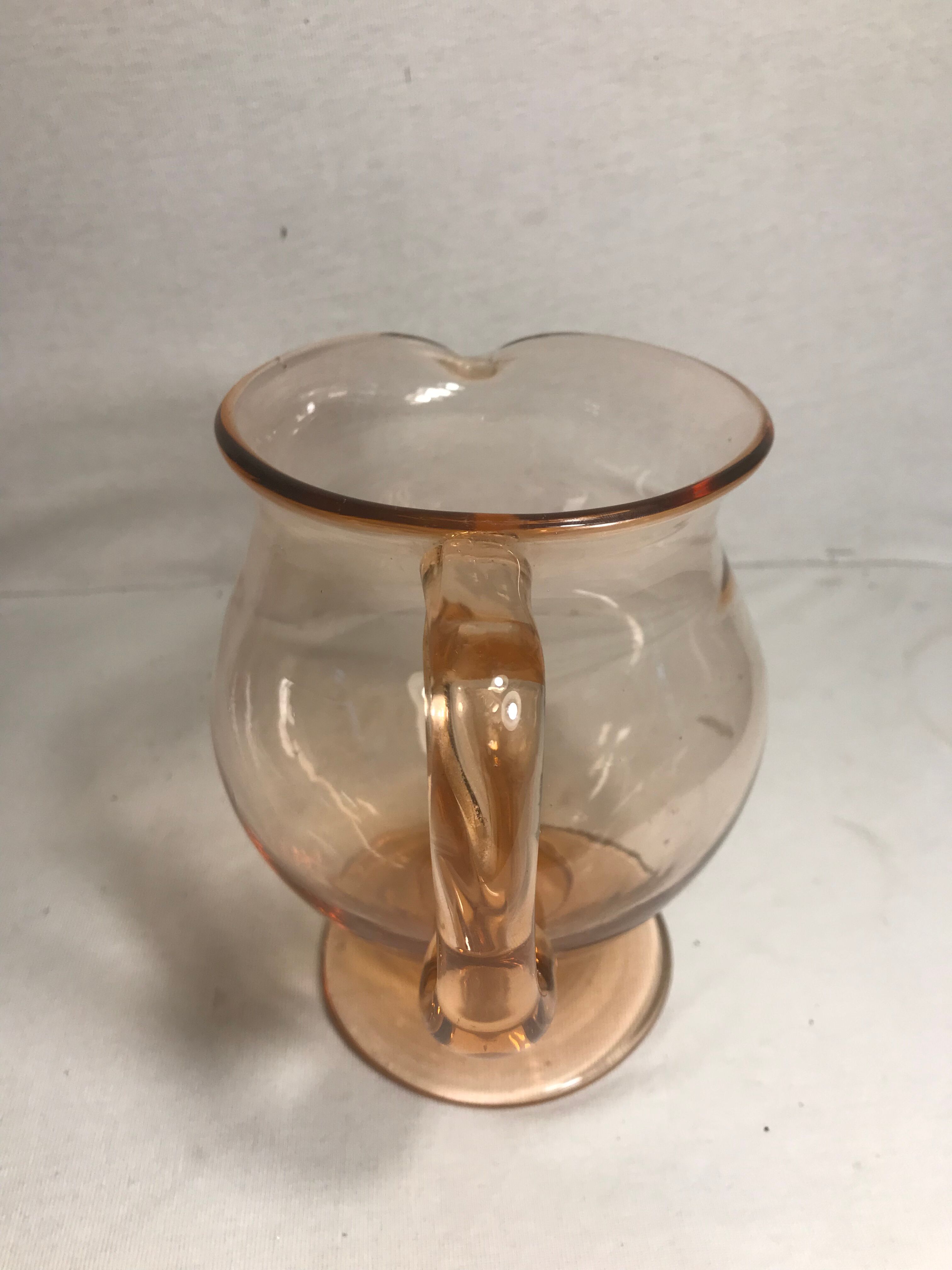 Pink pitcher in bubble glass