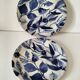 Two flat plates in earthenware with blue floral decoration.