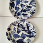 Two flat plates in earthenware with blue floral decoration.
