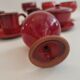Red enamelled terracotta: cups, saucers, glasses
