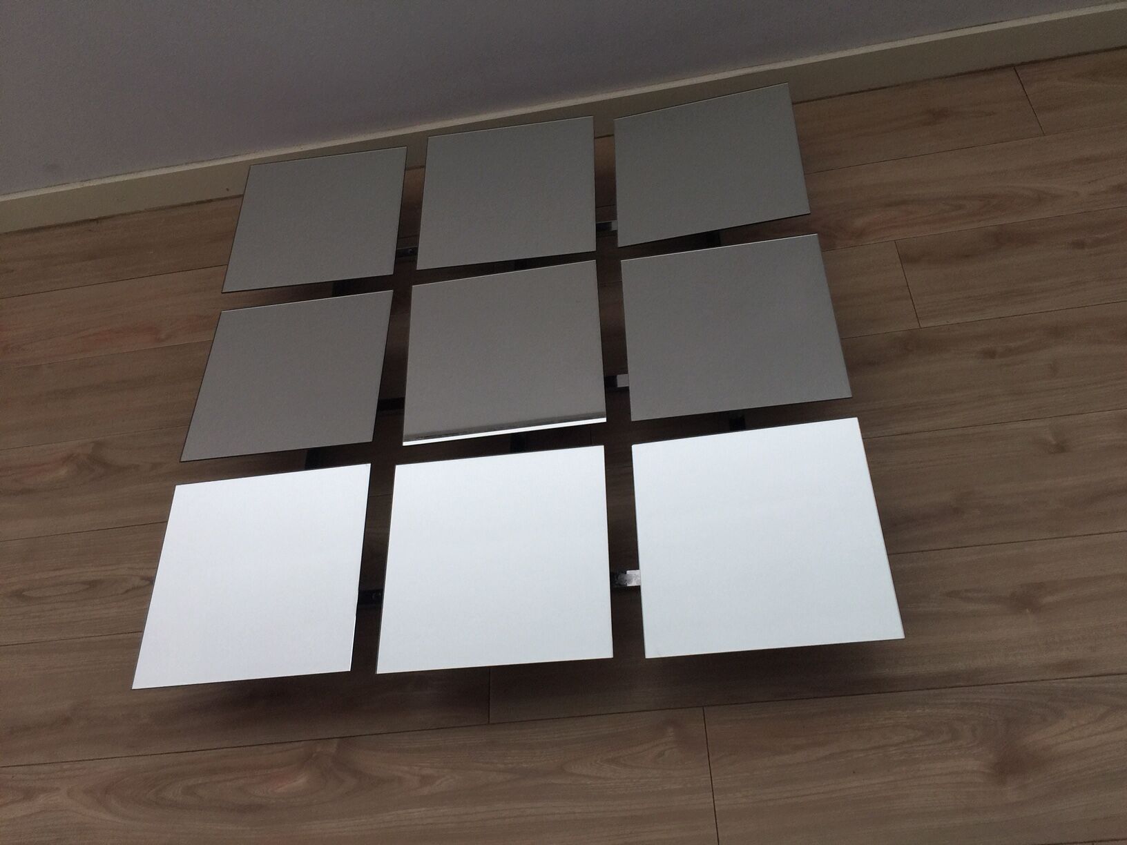 Scandinavian mirror has 9 removable panels by Markus Borgen