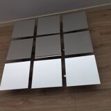 Scandinavian mirror has 9 removable panels by Markus Borgen