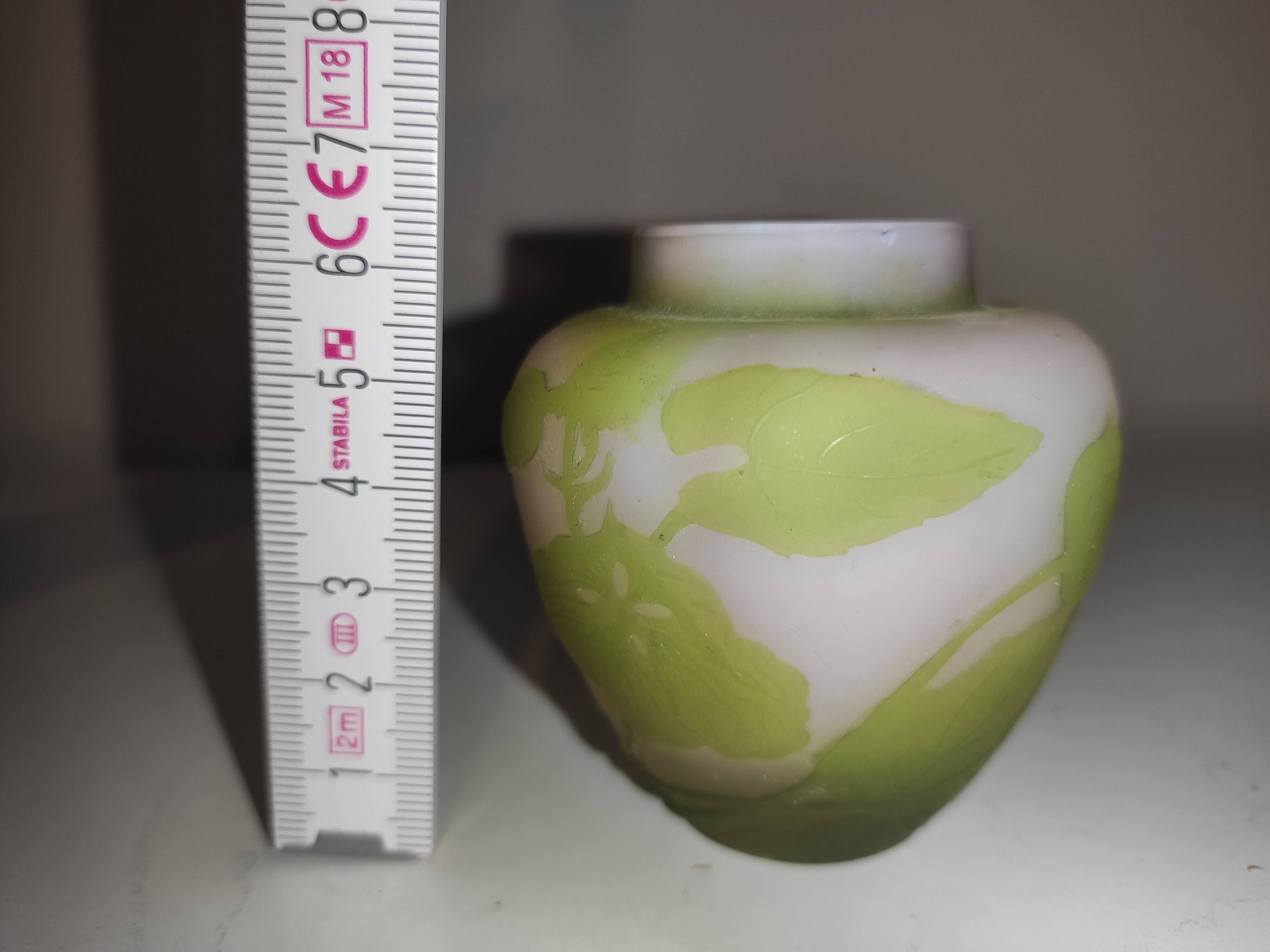 Small E. Gallé vase, "star" signature, light green tone on white background.
