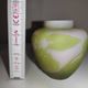 Small E. Gallé vase, "star" signature, light green tone on white background.