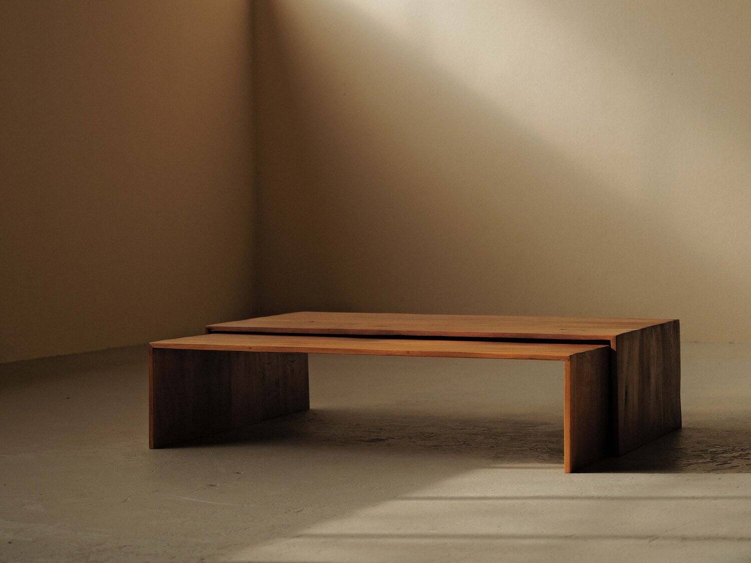 Pair of nesting coffee tables in solid wood, around 1980.