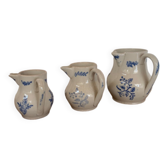 Three decorative ceramic pitchers