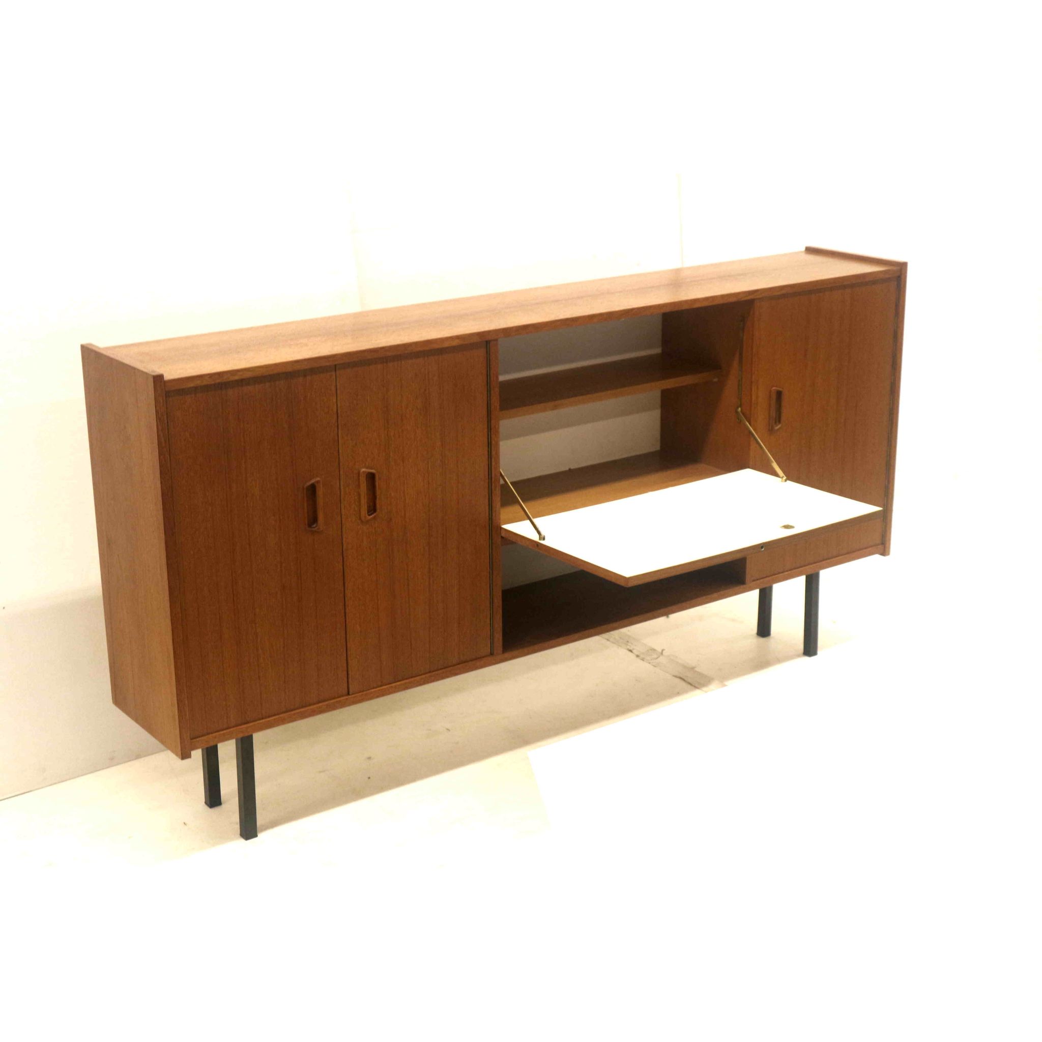 Vintage sideboard cabinet with beautiful handles on metal legs