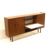 Vintage sideboard cabinet with beautiful handles on metal legs