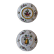 Two earthenware plates with fruits, pears and plums.