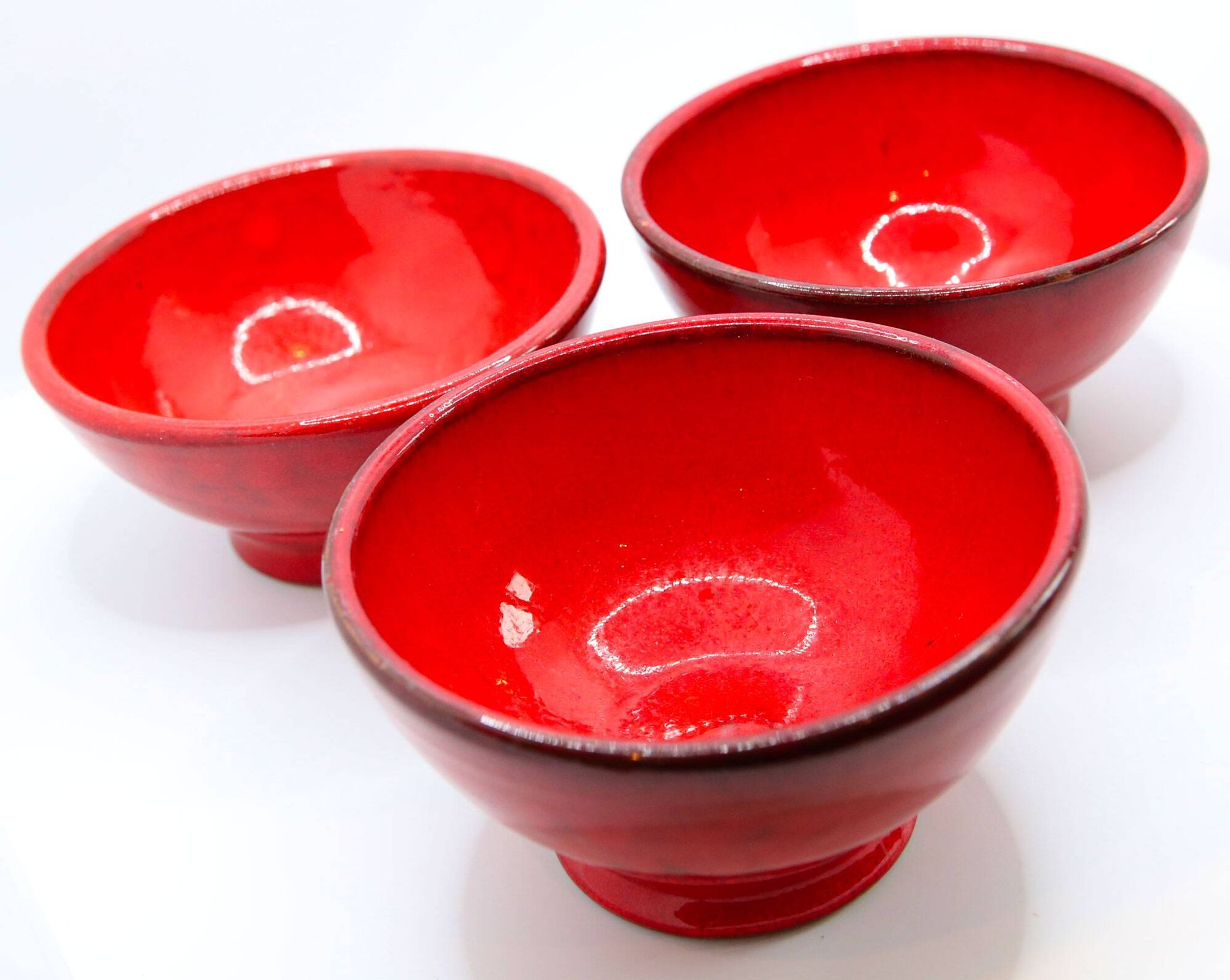 Set of 3 bright red enamelled earth bowls made in France