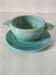 Earthenware bowl and saucer in glazed water green ceramic.