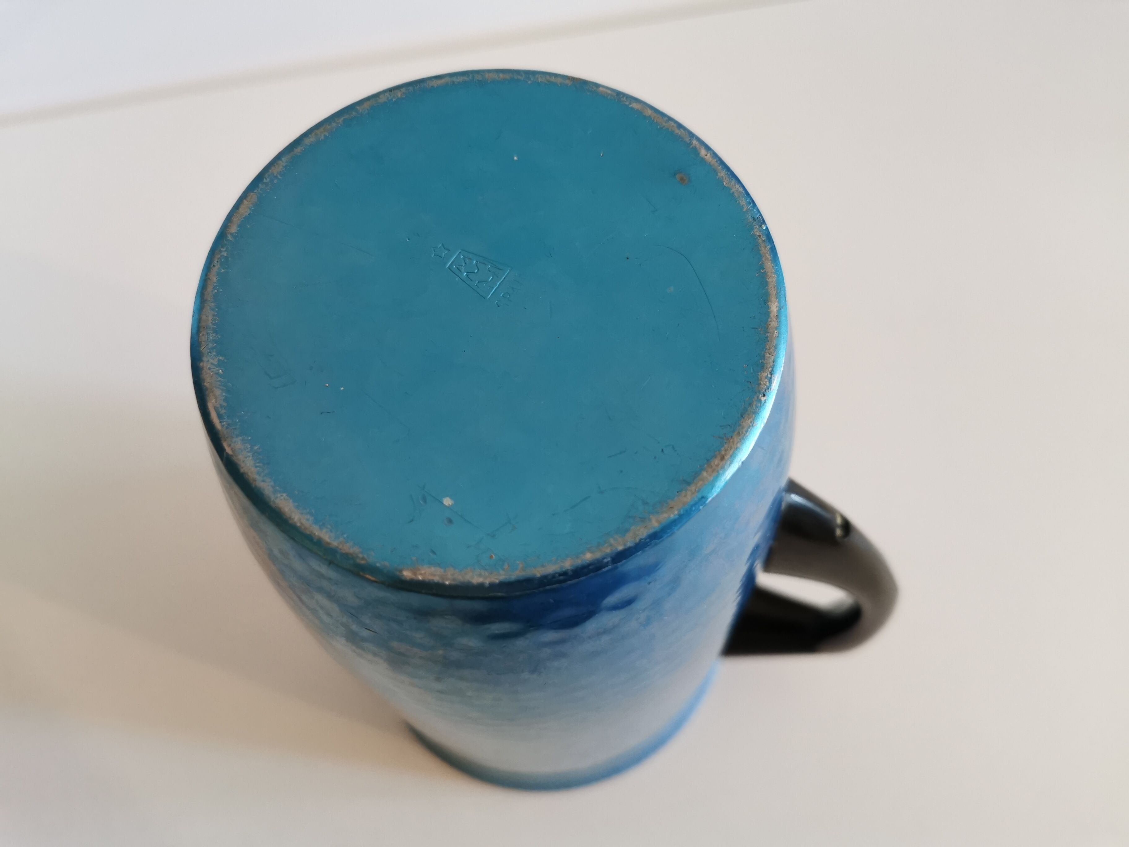 Vintage hammered blue metal pitcher