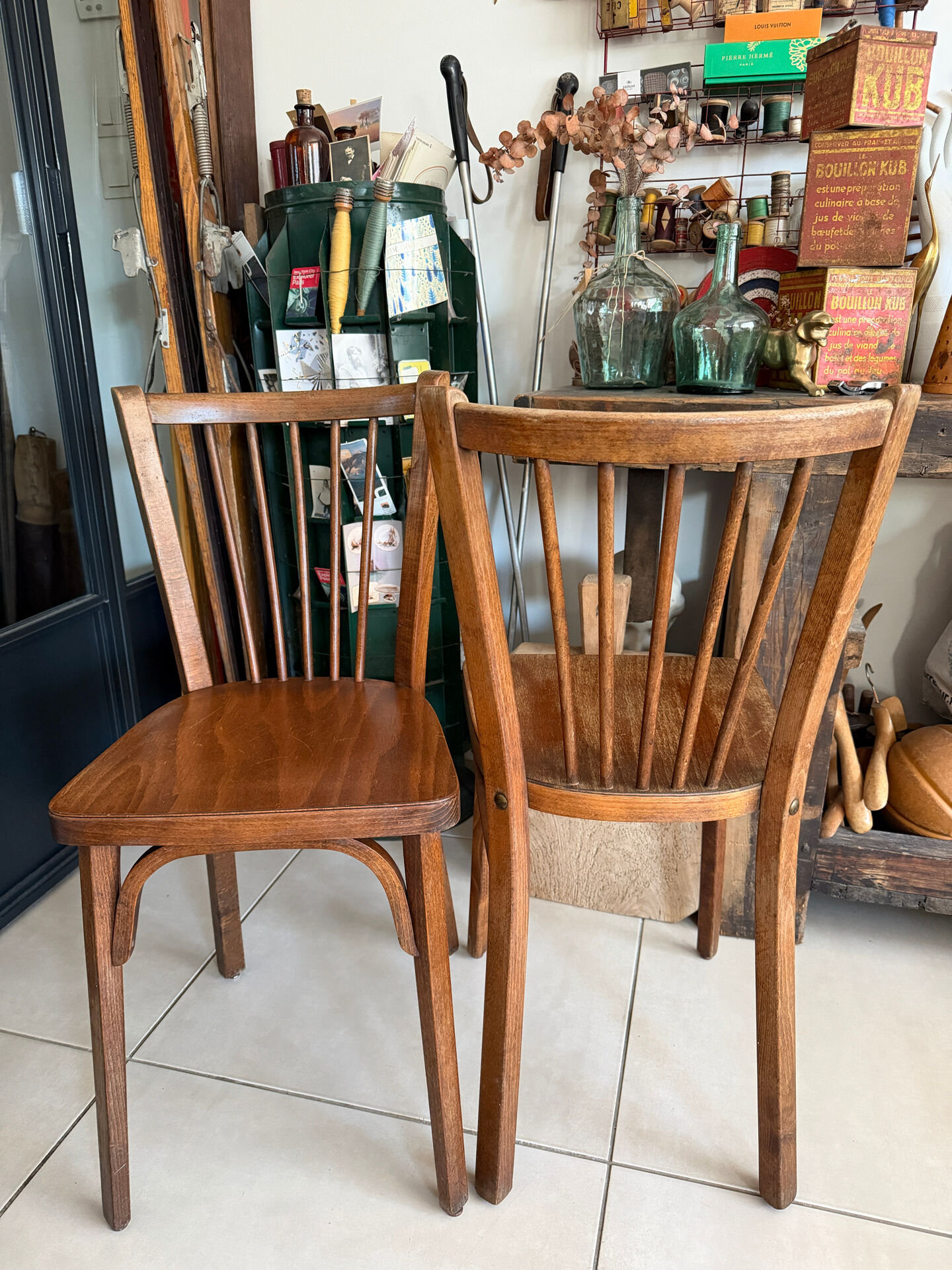 Pair of vintage Baumann bistro chairs in wood.