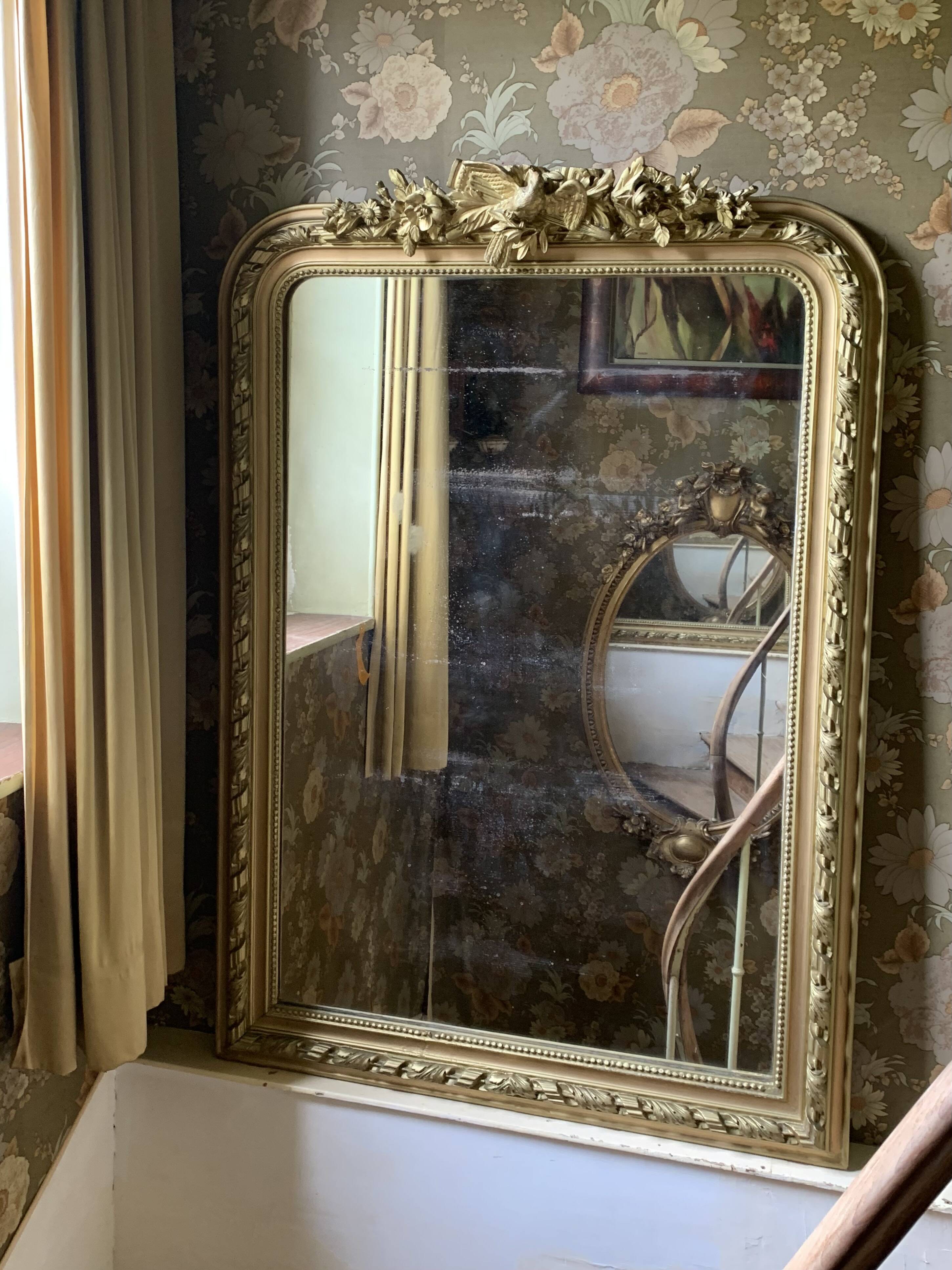 Gilded wooden fireplace mirror with pediment