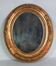 Antique oval mirror with original stucco and gilt wood frame, 37x31 cm. Beautiful patina.