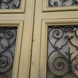 Porte d'entrée cintrée double en chêne, grilles et verre, XIXème