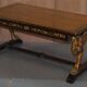 Double-sided writing desk in hardwood with gilt griffins, RJ Horner style.