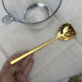 Ice bucket and golden spoon