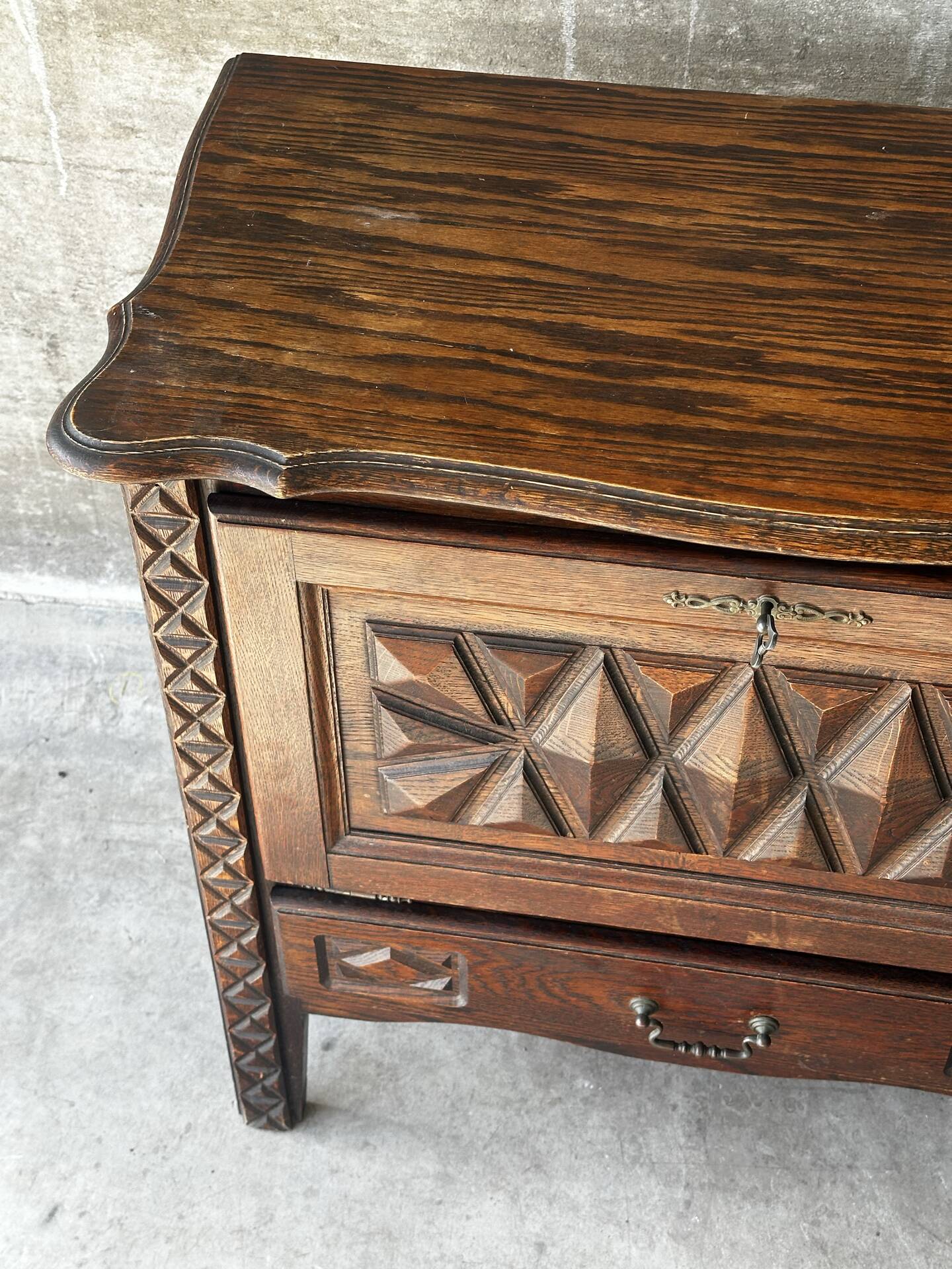 Small storage cabinet in carved oak – circa 1930