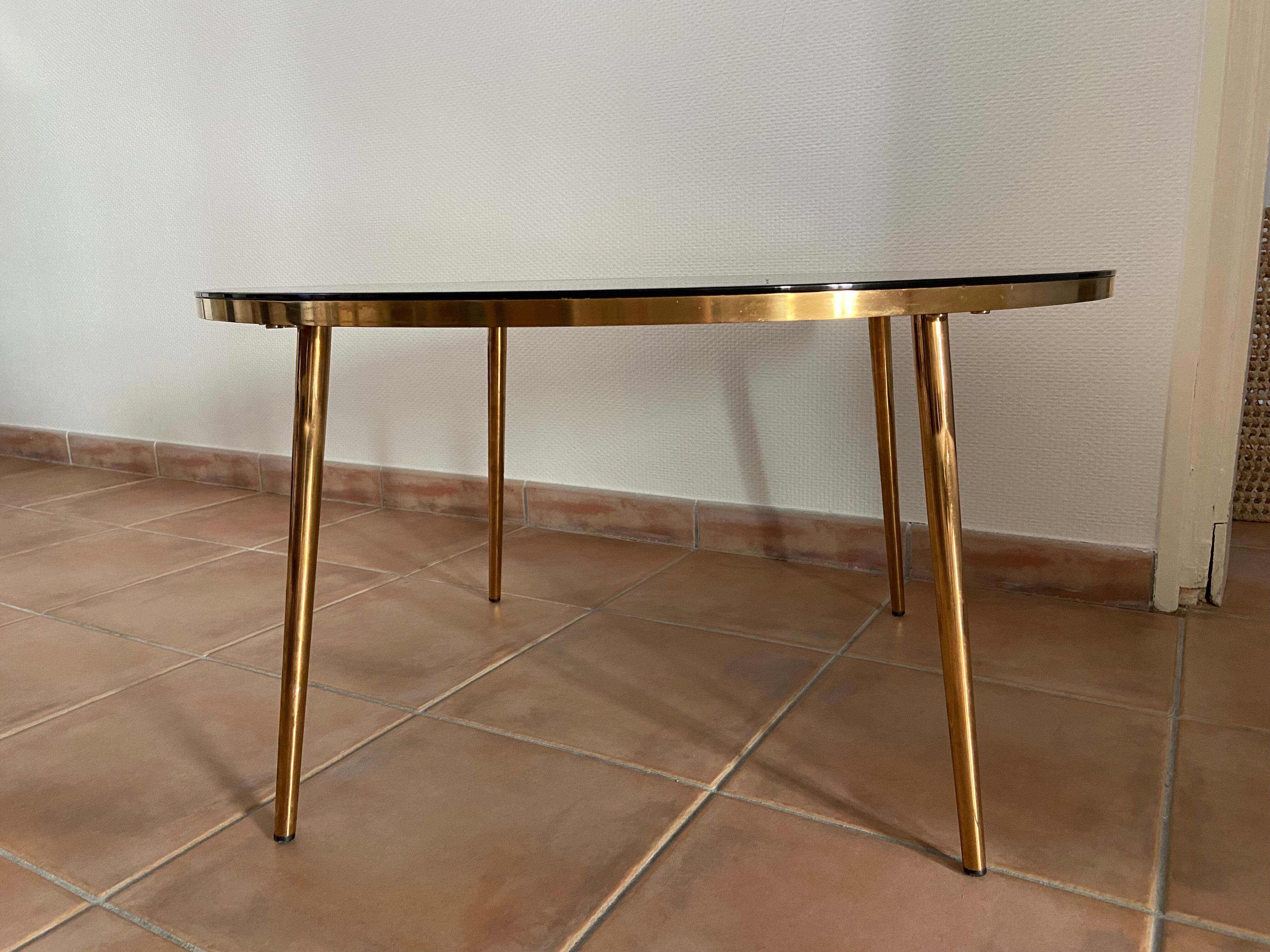 Coffee table black glass top and golden compass legs