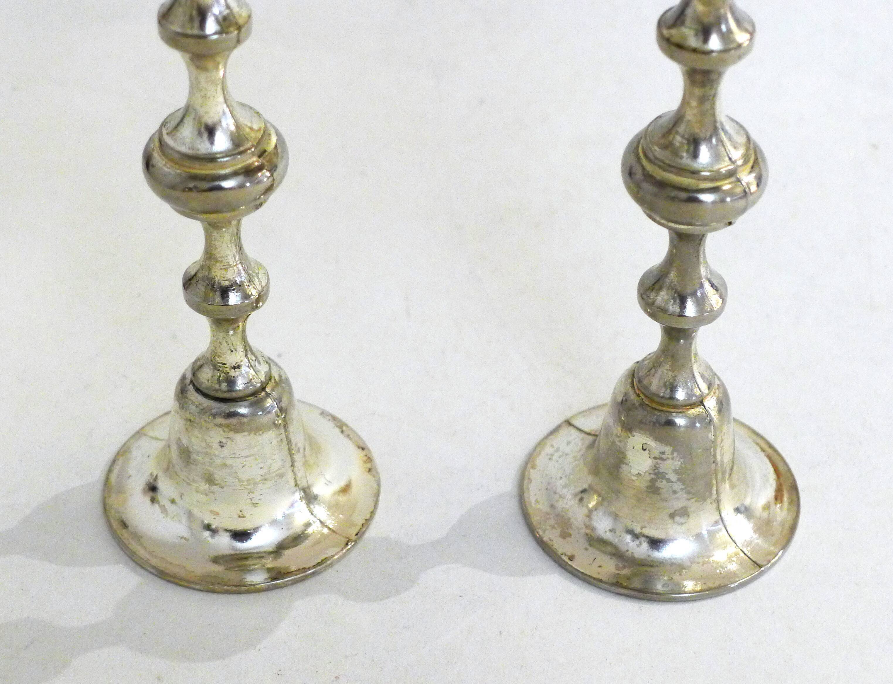 Pair of metal candle holders