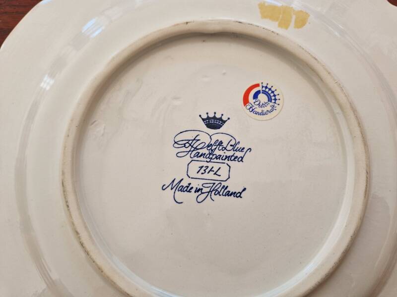 Delft Blue earthenware plate with a mill by a river decoration