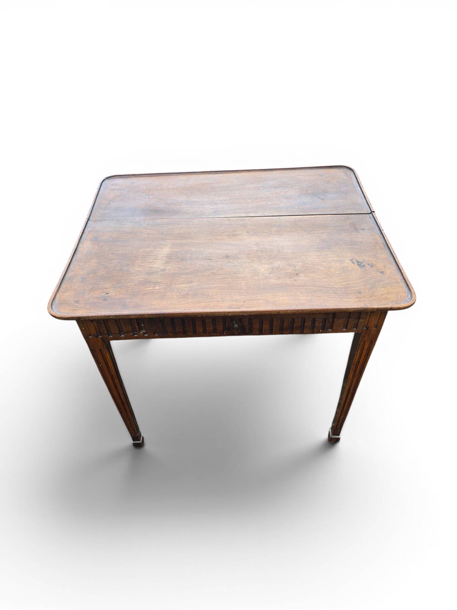 Antique game table in patinated wood in the Louis XVI style.