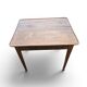 Antique game table in patinated wood in the Louis XVI style.