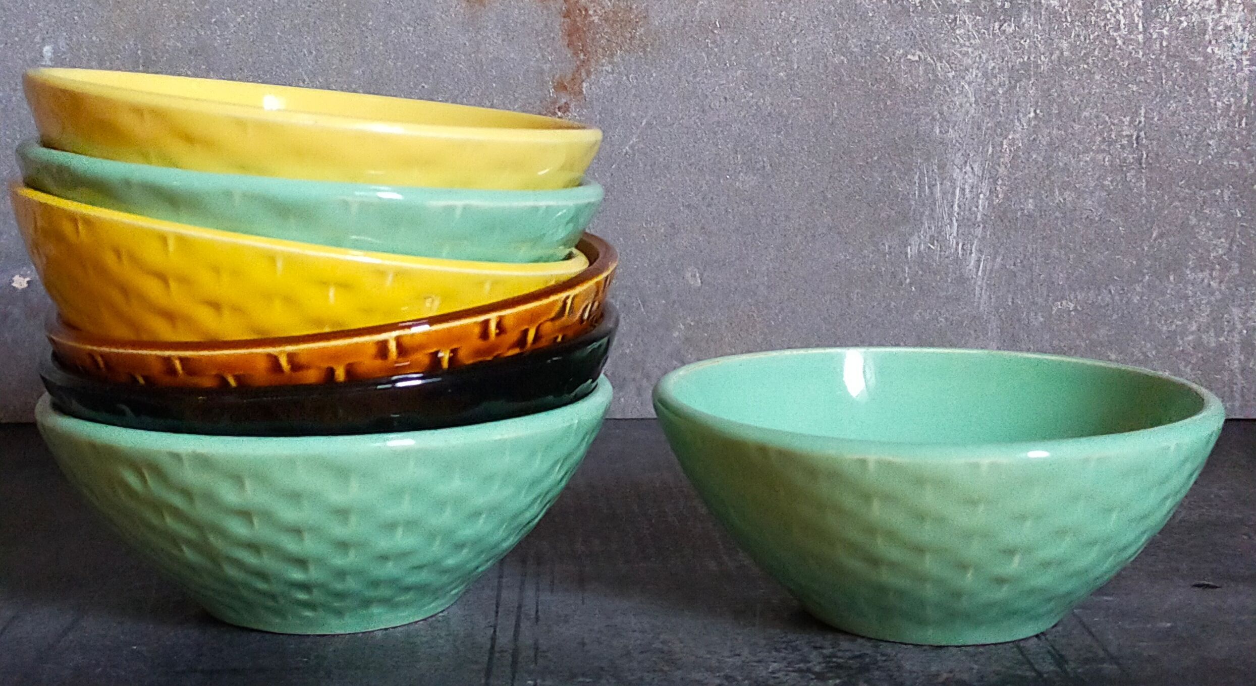 Seven vintage slip ceramic bowls