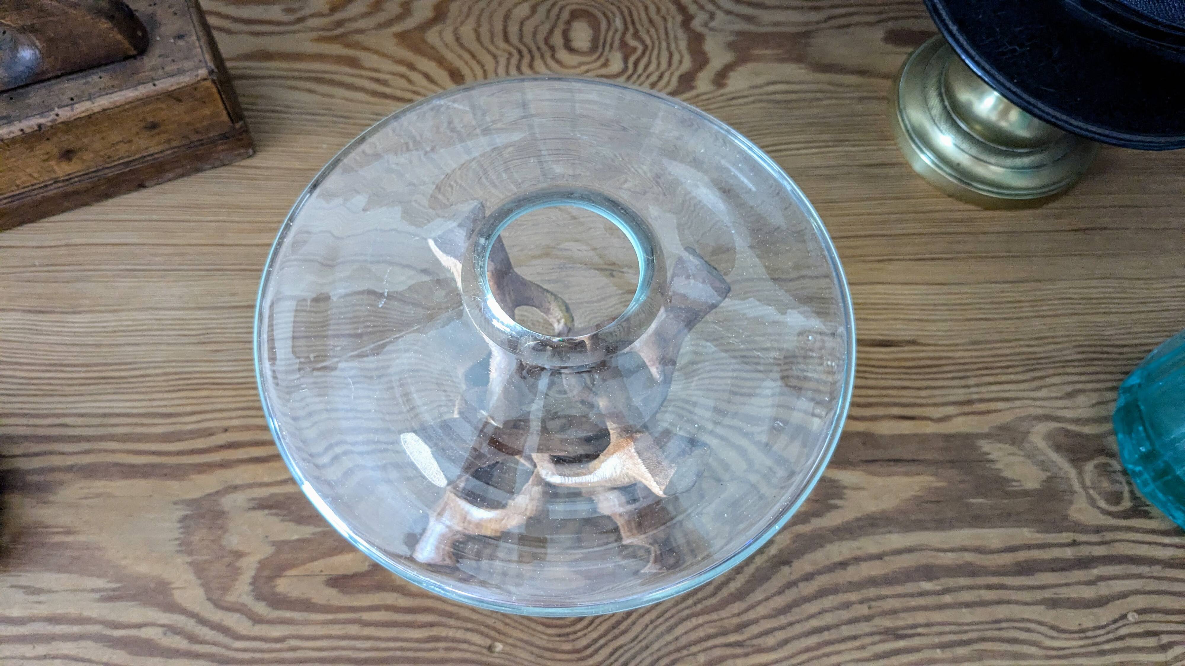 Glass cup molded on carved exotic wood