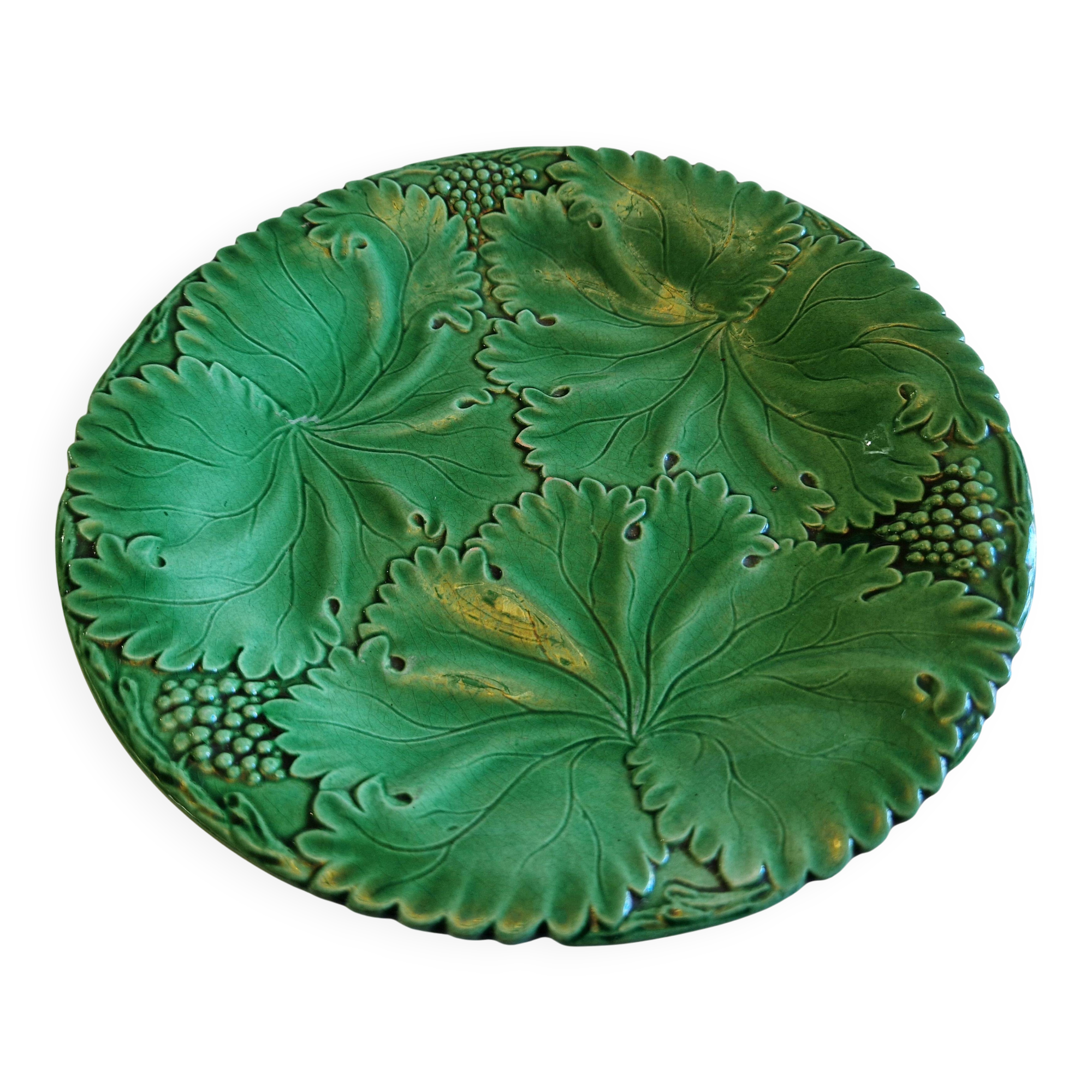 8 green barbotine plates from the early 20th century.