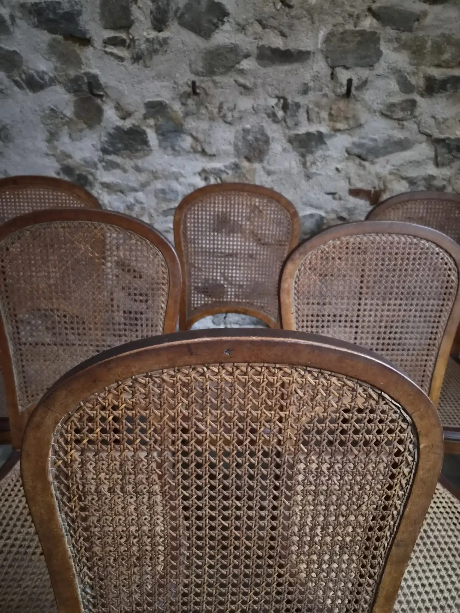 Set of 6 antique Louis XVI style dining chairs with caning.