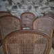 Set of 6 antique Louis XVI style dining chairs with caning.