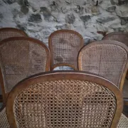 Set of 6 antique Louis XVI style dining chairs with caning.