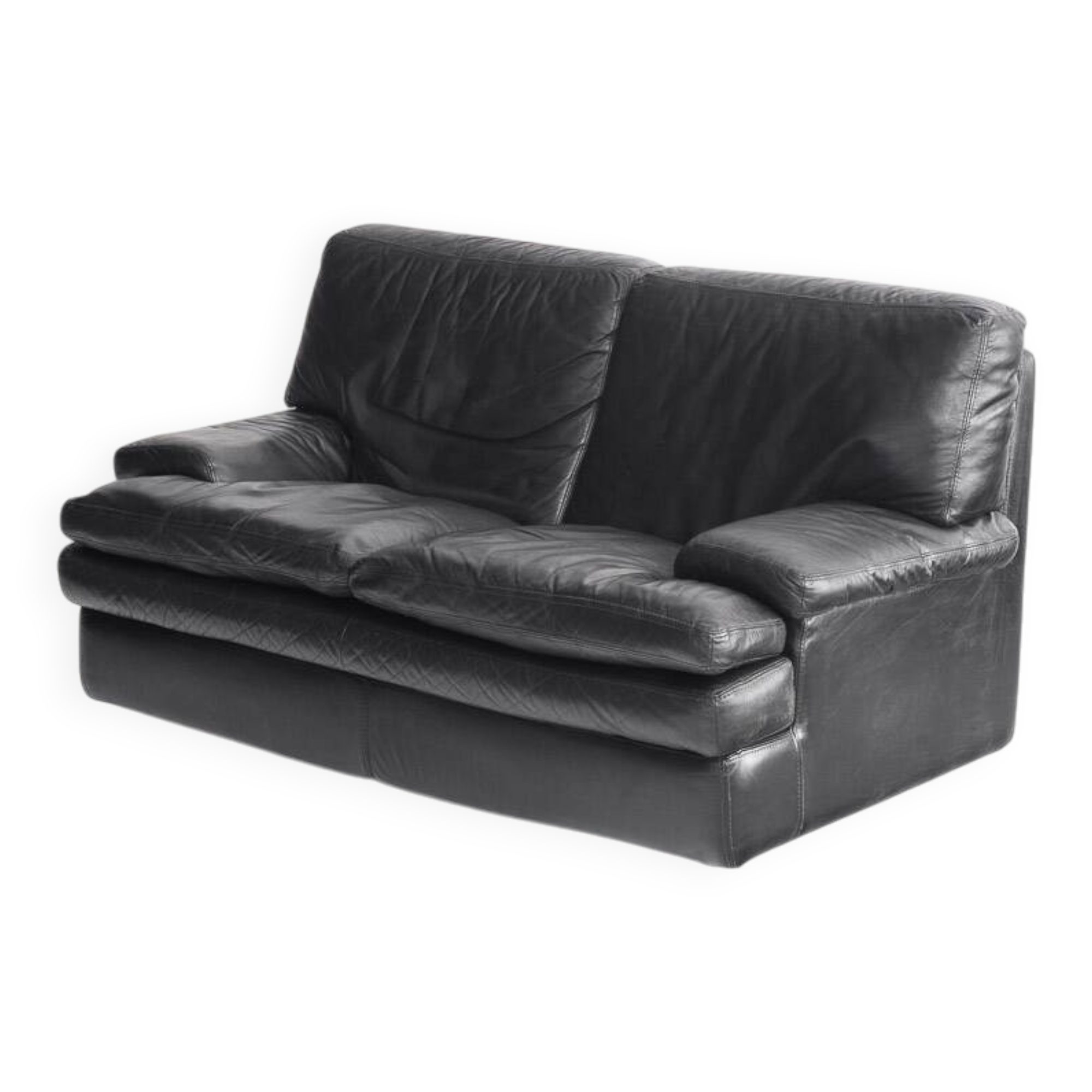 Black leather two-seater sofa. Roche Bobois edition. France, 1980s.
