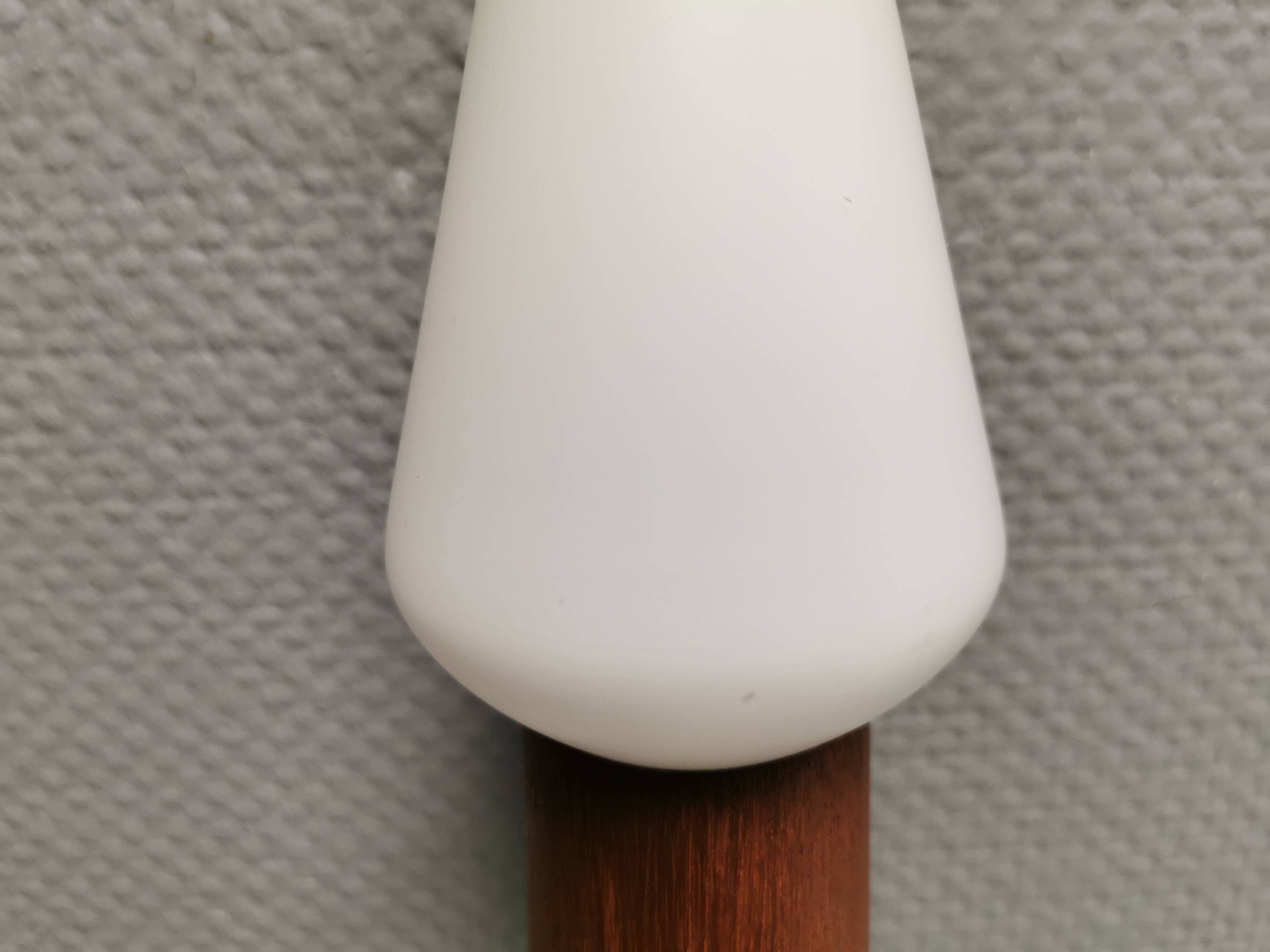 Wall lamp in teak with milky white cone-shaped shade in double glass
