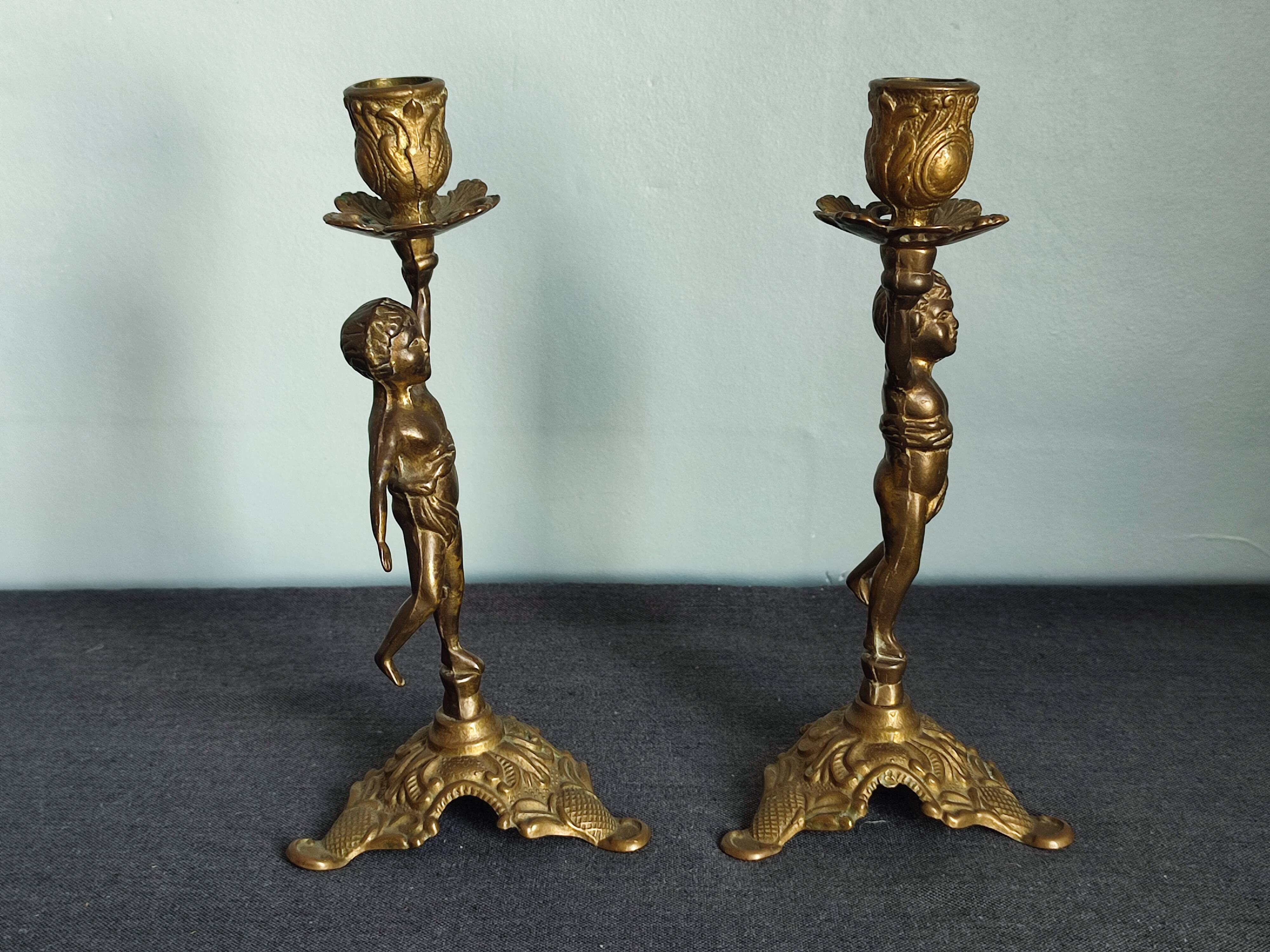 Set of two cherub cherub candlesticks