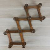 Extendable wall coat rack