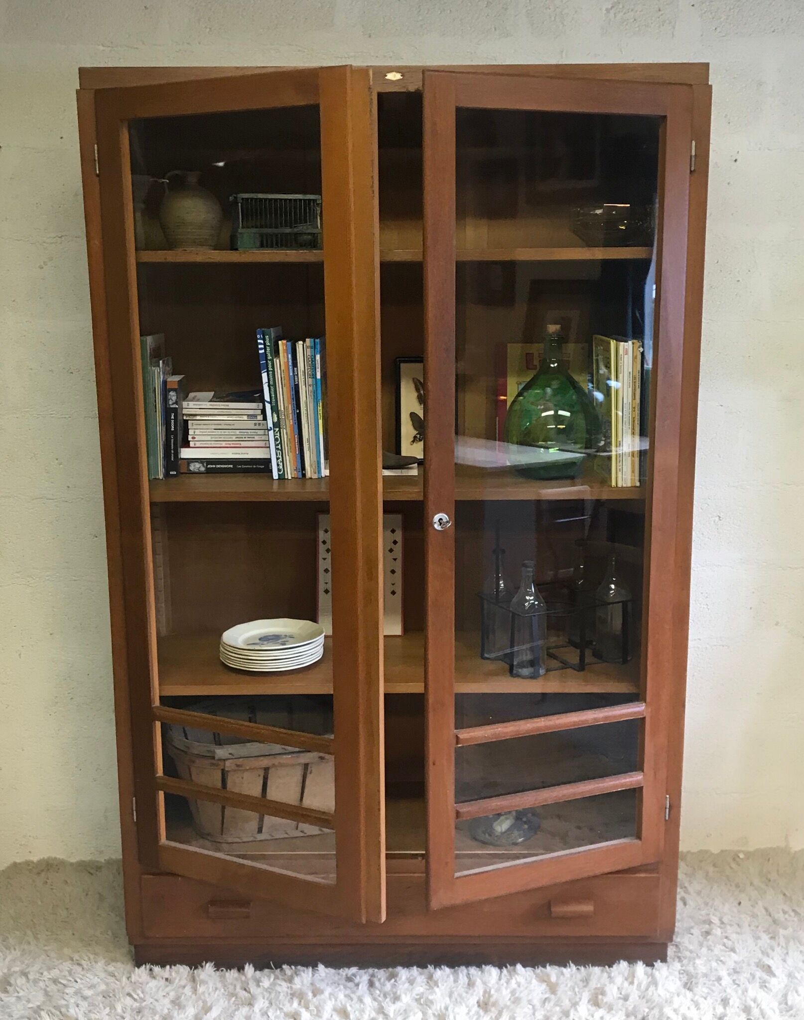 Old school glass bookcase in blond wood