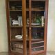 Old school glass bookcase in blond wood