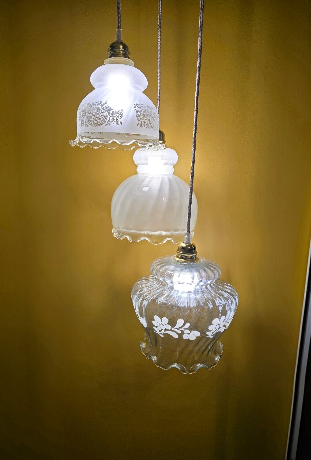 Original suspension of three vintage transparent glass globes.