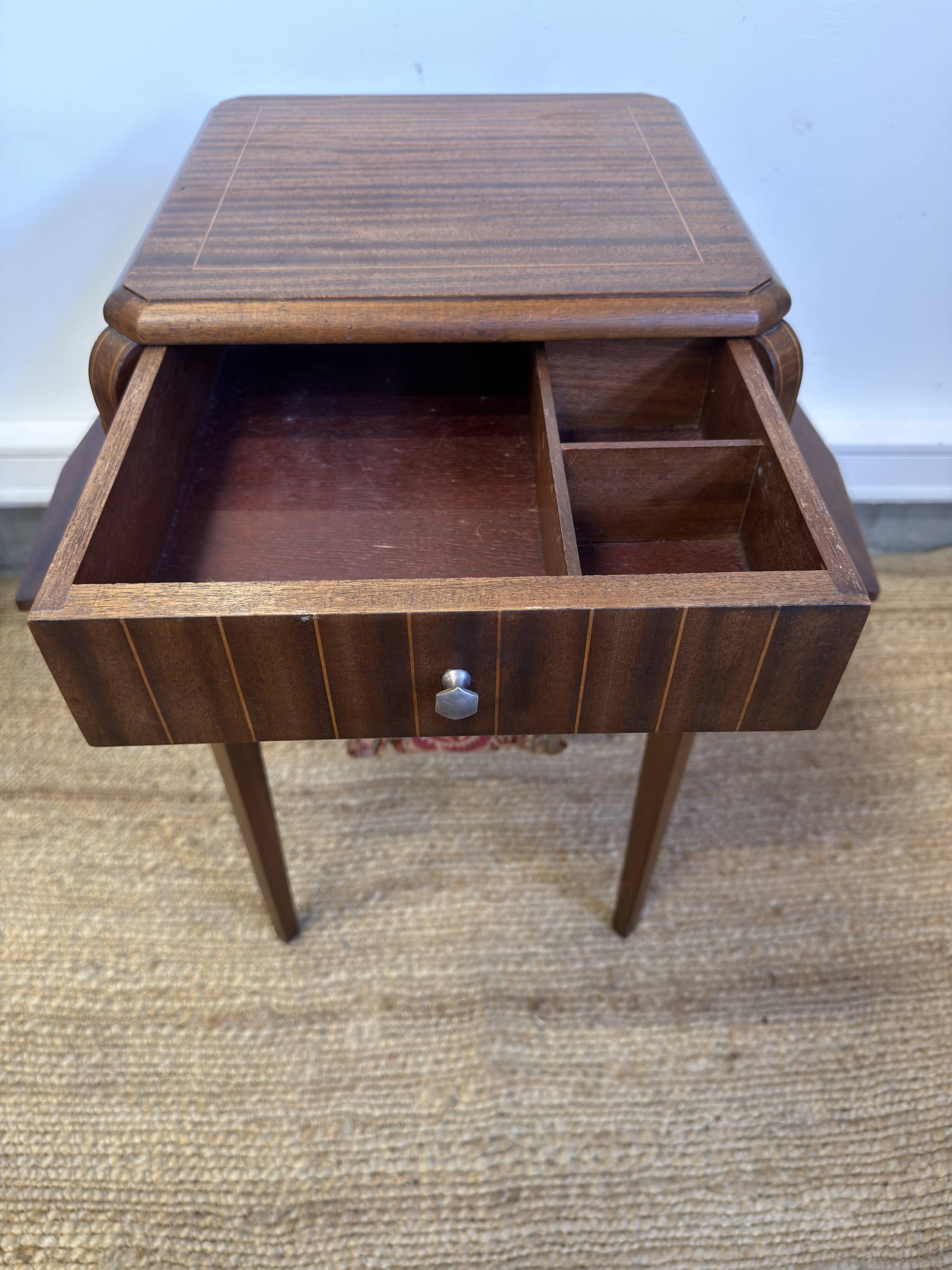 Art Deco sewing table in walnut with a foldable shelf.