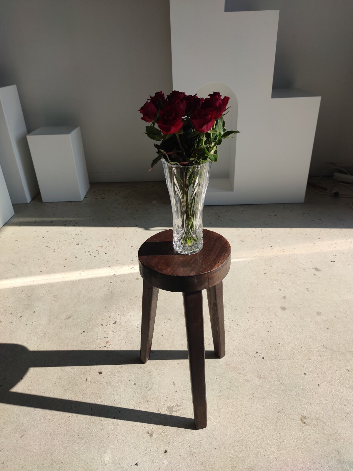 Small high tripod stool in brown solid wood