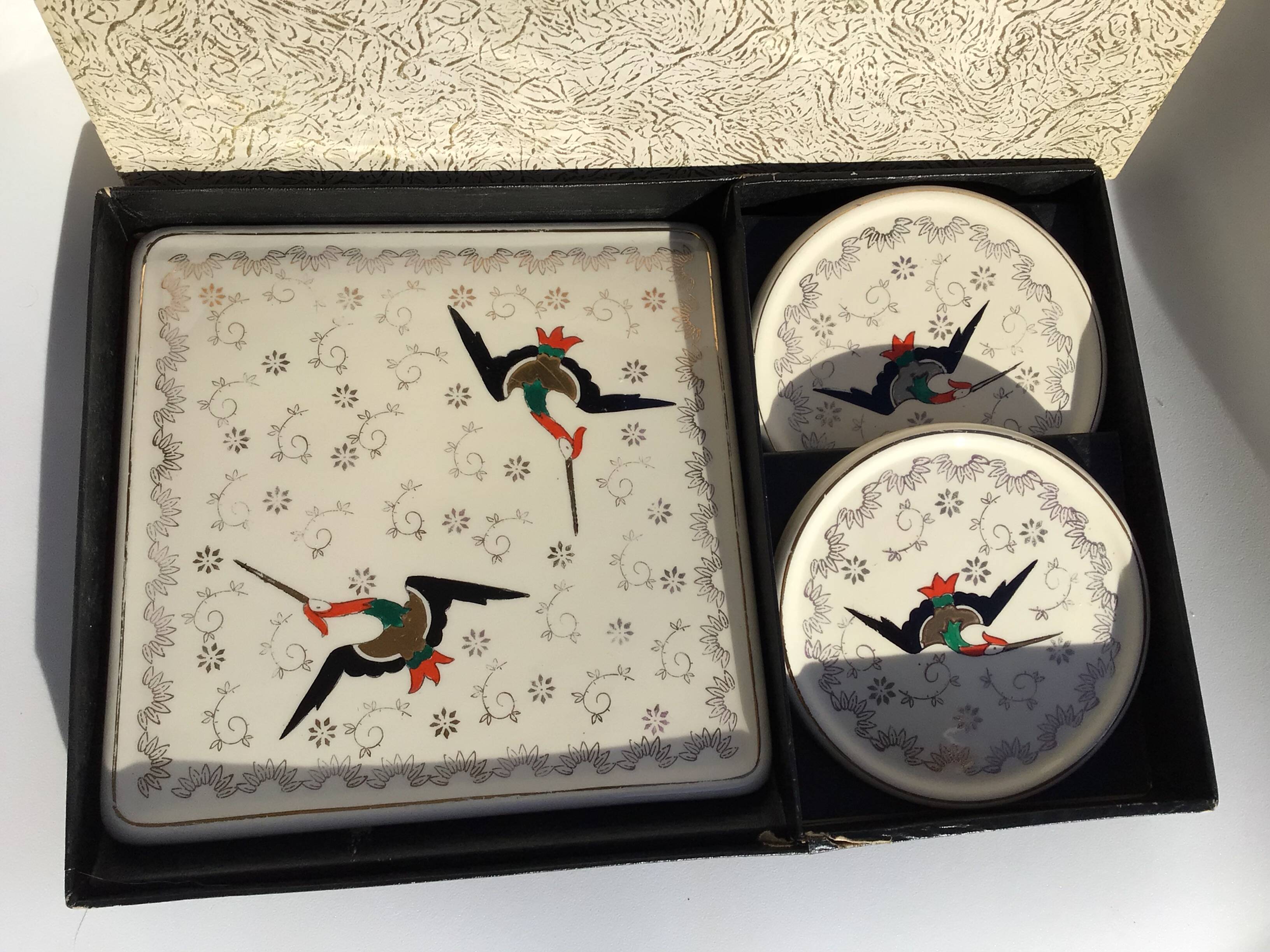 Longwy Chypre cream trivets and bottles