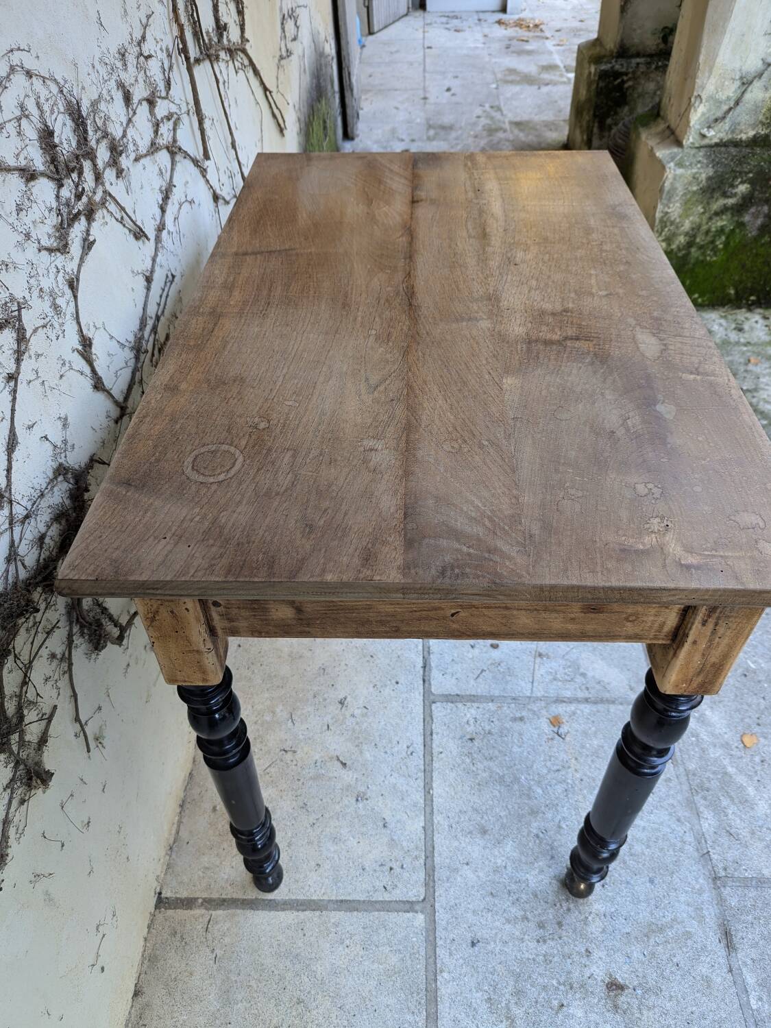 Solid wood desk, black base