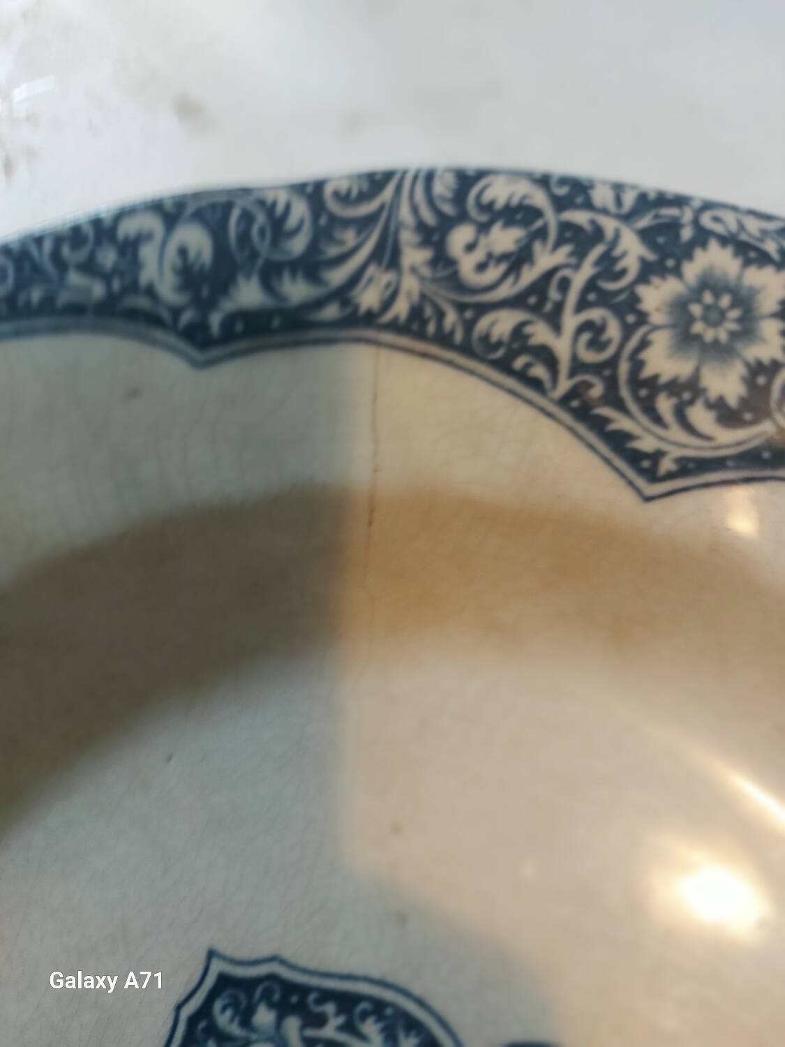 Two antique 19th-century plates, one flat and one deep, from Gien.