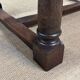 English monastery table with extensions from the late 19th century in elm and oak.